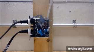 Electrical fire demonstration showing overheated wire smoking and burning